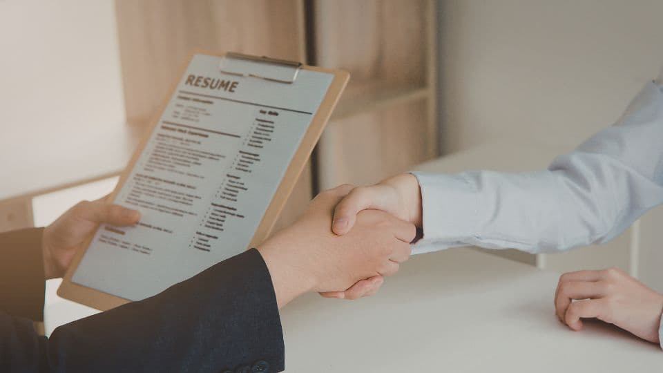 Handshake over a résumé